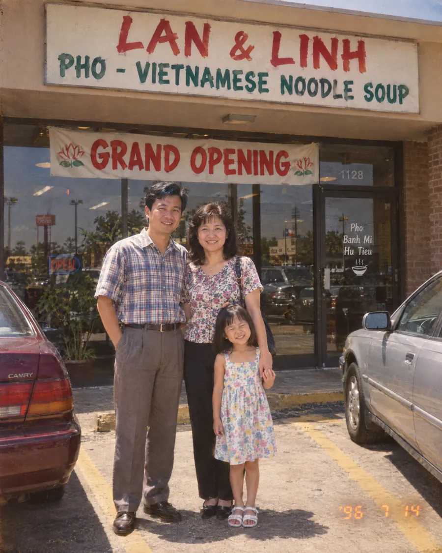 Lan, her husband and six-year-old Linh at the grand opening in 1996