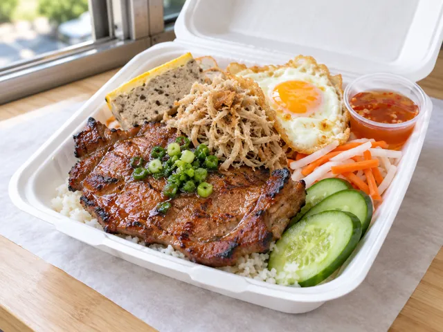 Cơm tấm with a pork chop, egg meatloaf and a fried egg in a takeout box