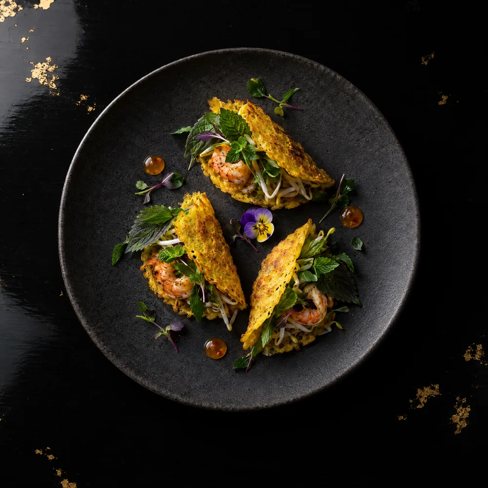 Bánh xèo — Turmeric crêpe, tiger prawn, perilla