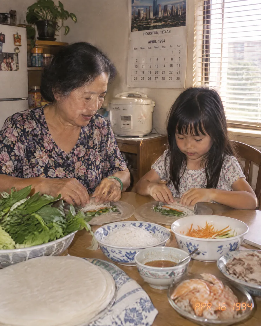 Chef Khánh as a child rolling spring rolls with her grandmother in Houston, 1994